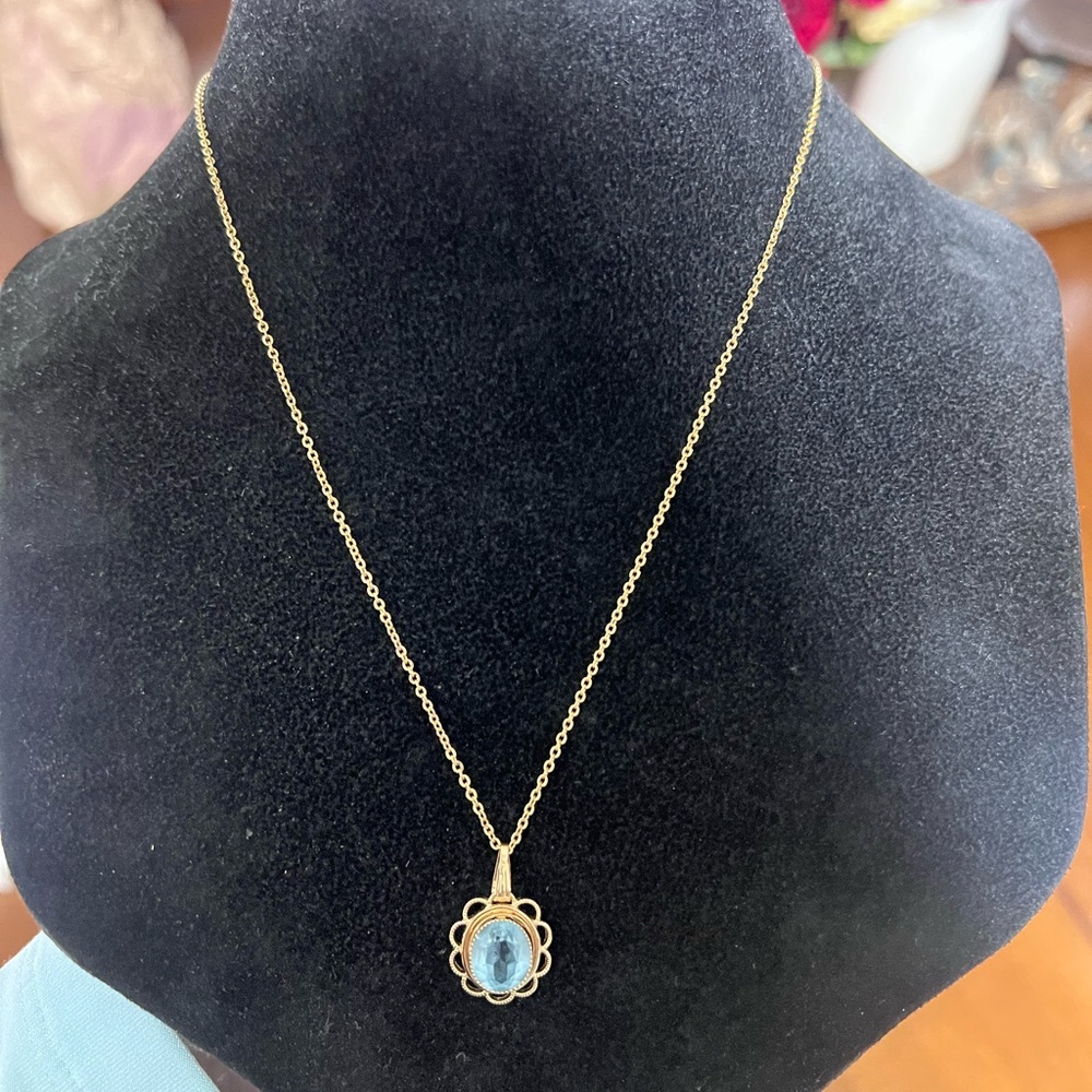 Elegant Gold Necklace with Blue Stone Pendant